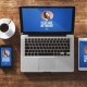 image of digital devices on a brown desk