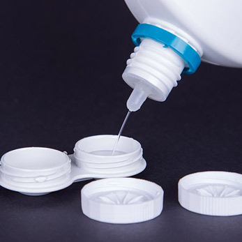 Contact lens hygiene and cleaning solutions? 4 filling a contact lens case with contact lens disinfectant.